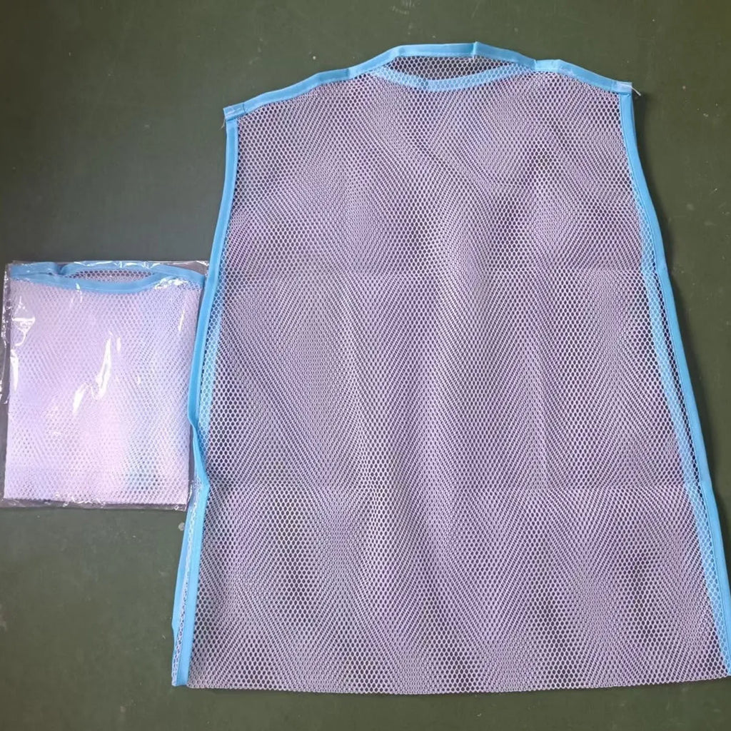 White fabric mesh pillow drying hanger with net pocket on a clothesline outdoors