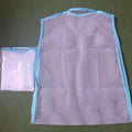 White fabric mesh pillow drying hanger with net pocket on a clothesline outdoors