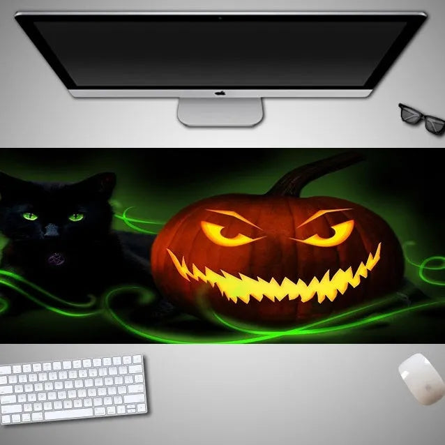 Oversized Halloween gaming mouse pad with non-slip rubber base on a desk