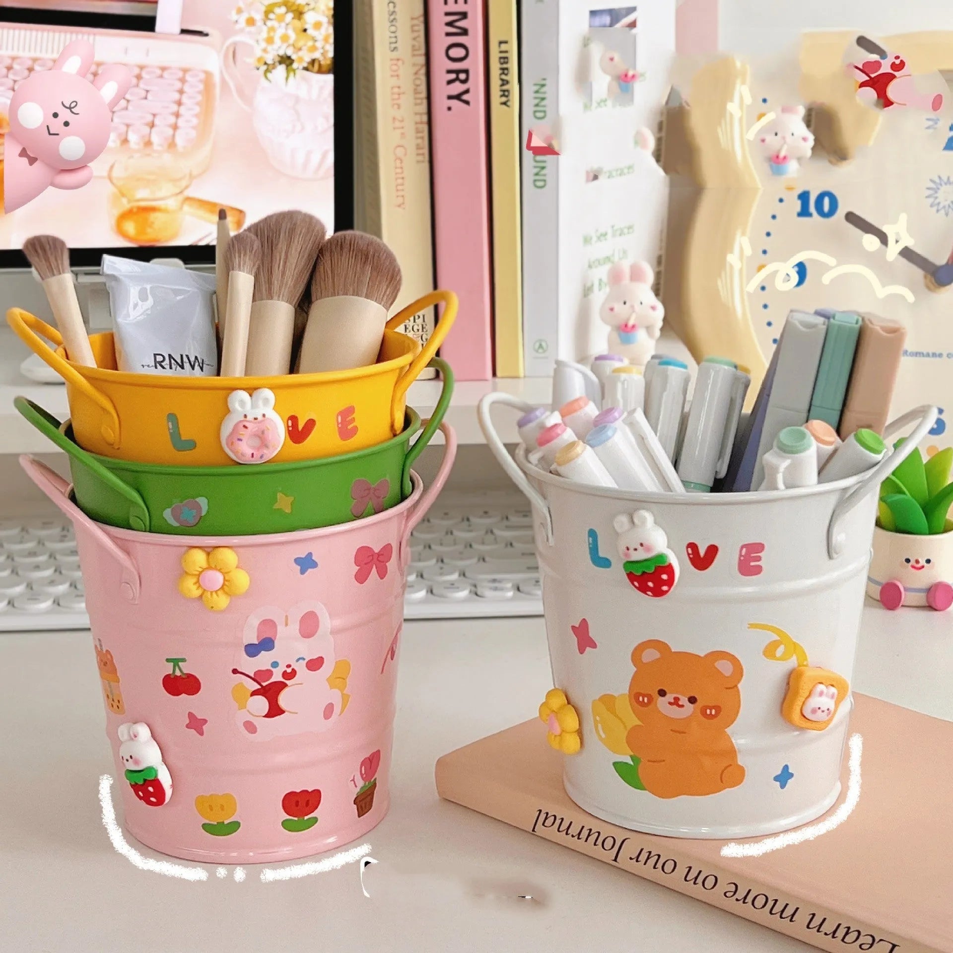 Round metal desk organiser pen holder in various colours including pink, green, red, white, and yellow.