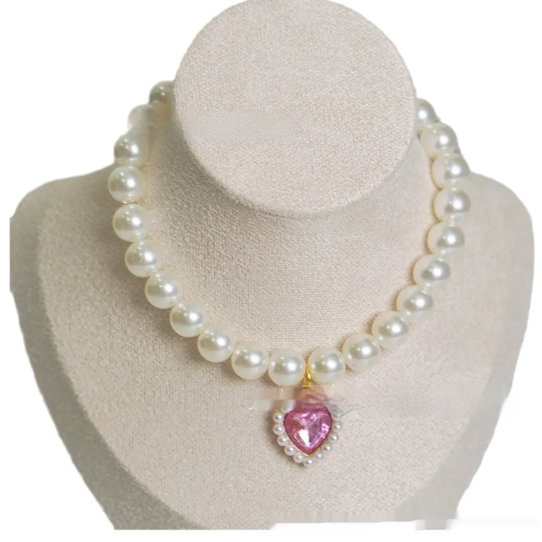 A decorative gem-style cat collar in plastic alloy resin, shown in multiple solid colours with adjustable sizing.