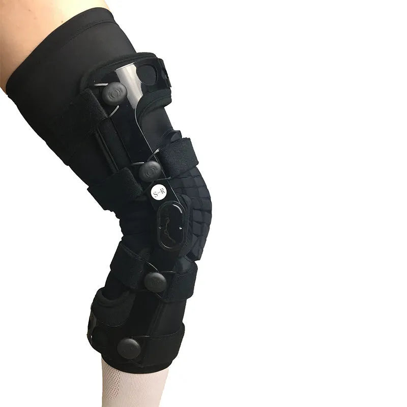 Black anterior ligament knee pad and supporter showing brushed cloth exterior with sponge cushioning