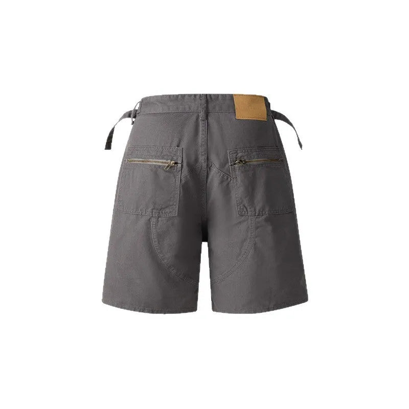 Retro-style loose-fit washed cotton shorts for men and women with a half elastic waistband.