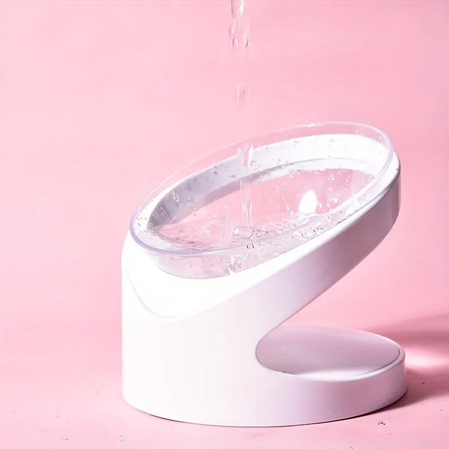 White elevated plastic cat food bowl with a tilted feeding surface for neck protection.