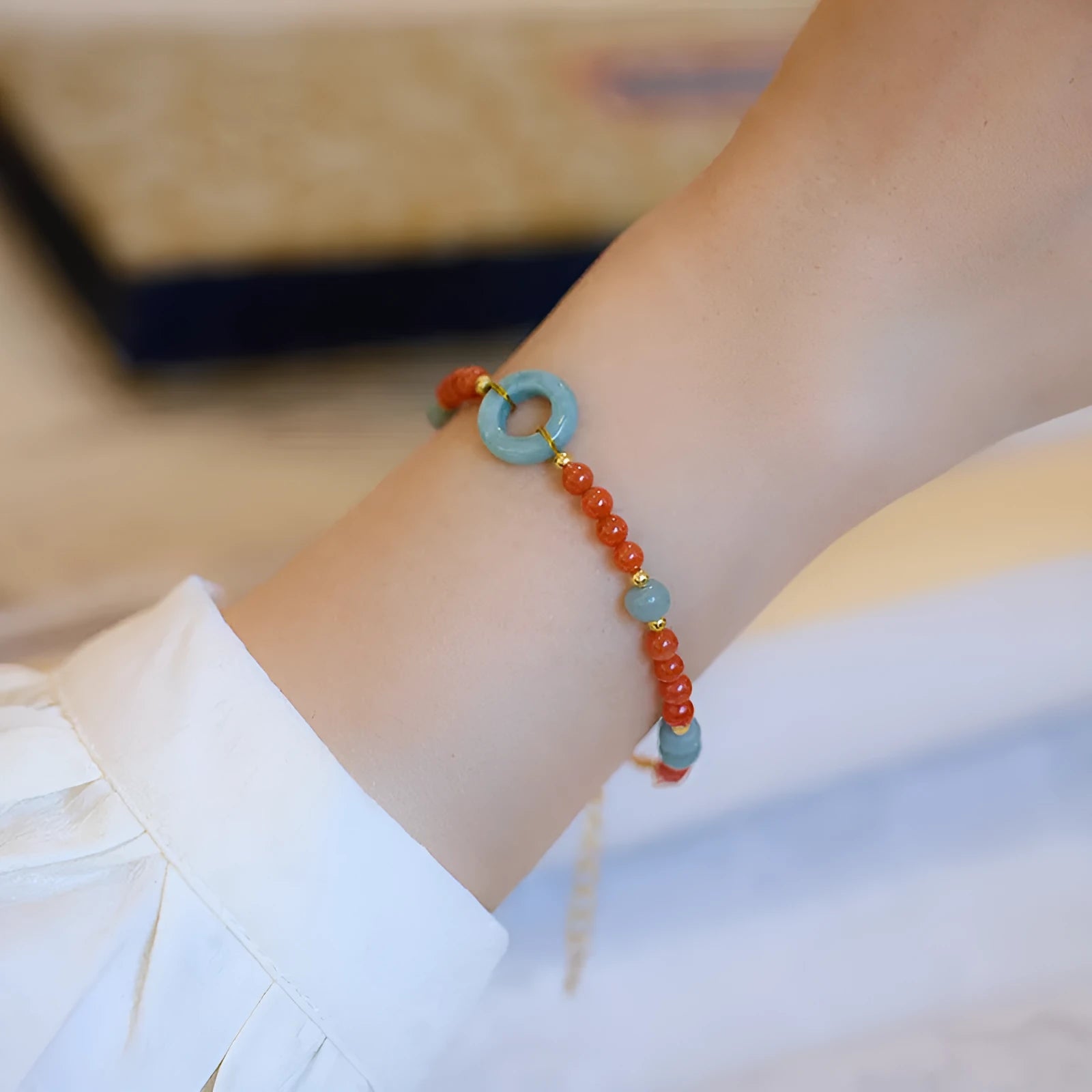 Natural South Red agate women's bracelet with geometric 4mm beads and an adjustable safety buckle clasp.
