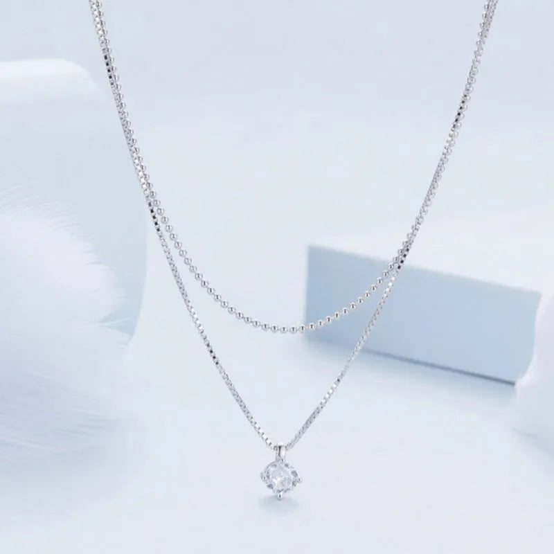 Double-layer sterling silver necklace with pearl chain and silver pendant