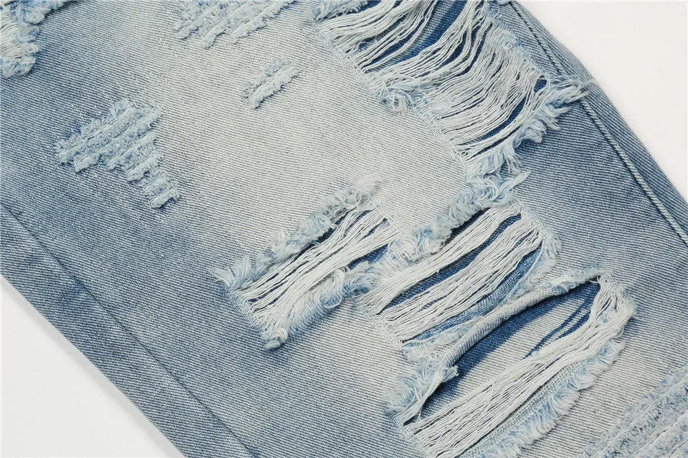Men's flared washed jeans in light blue denim with zipper fly