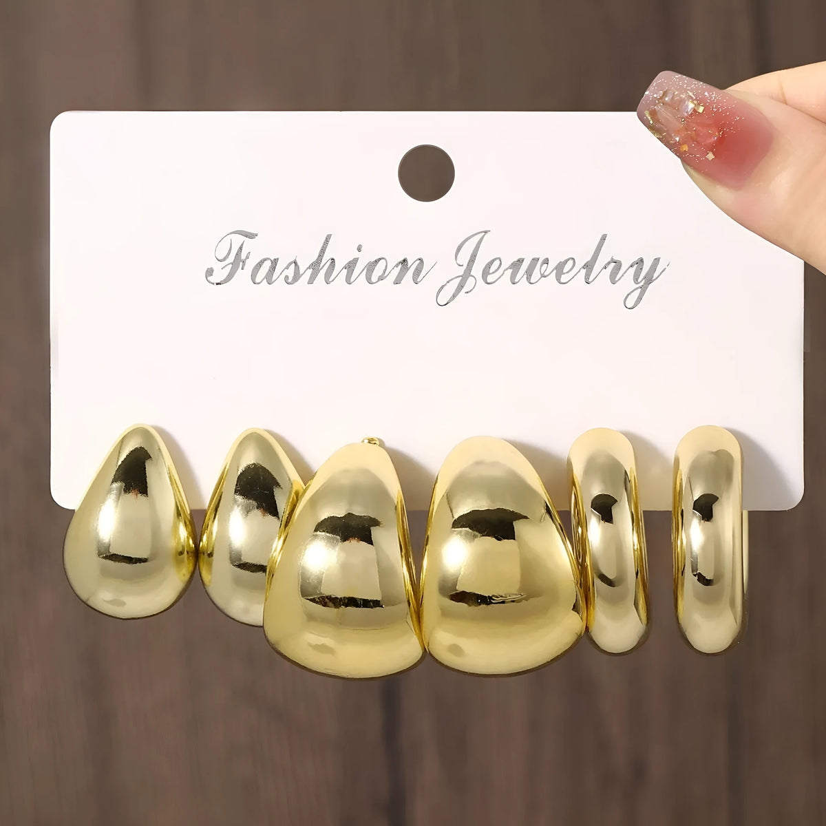 Three pairs of gold, silver, and black acrylic geometric double circle drop earrings set