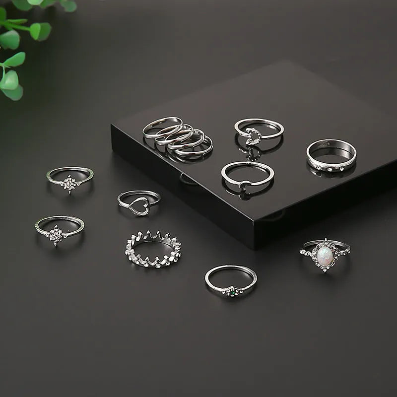 Vintage star and moon 13-piece ring set with opal and rhinestone accents in gold or silver electroplated zinc alloy