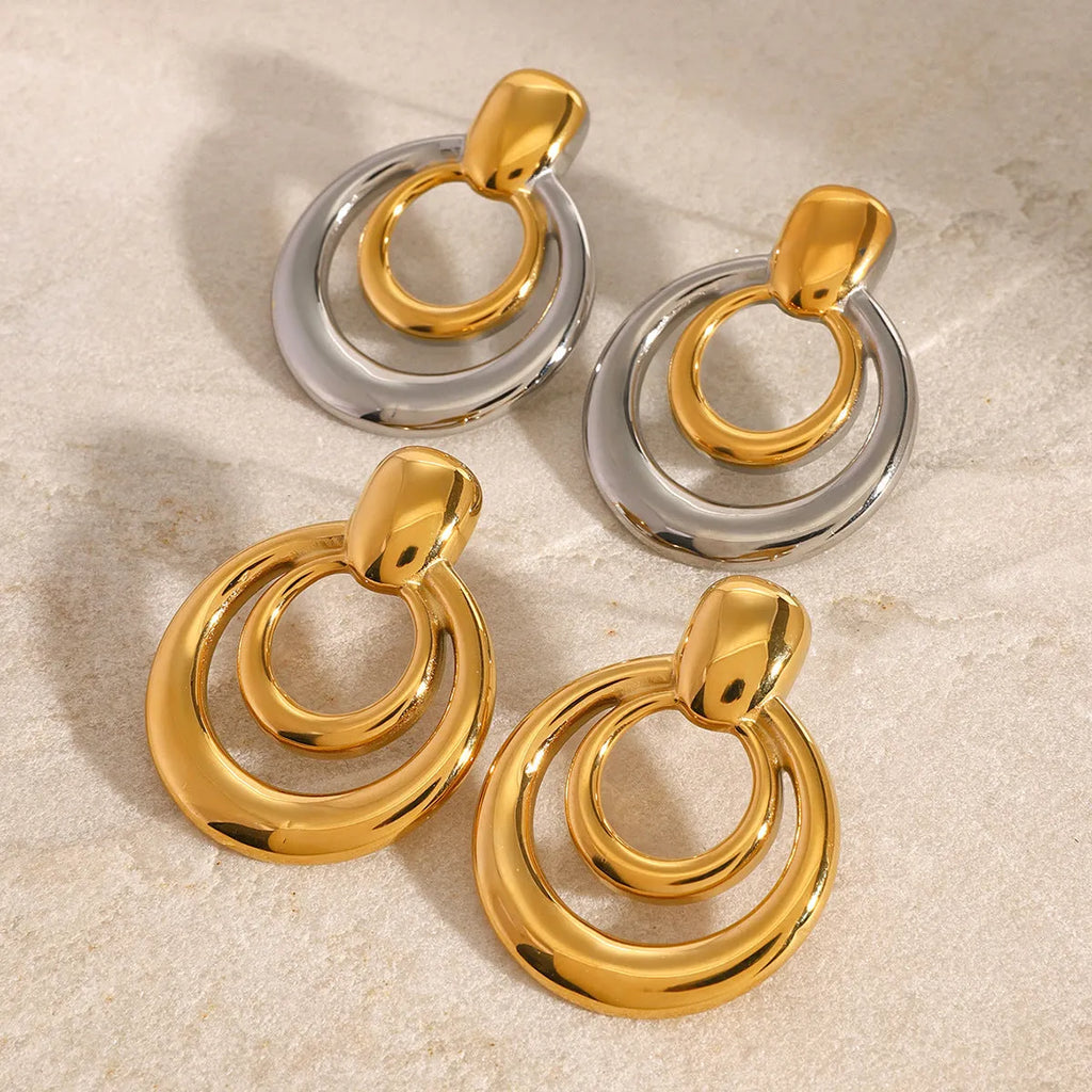 Round double layer hollow geometric stud earrings in gold tone with butterfly backs
