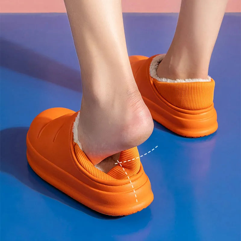 Yellow waterproof EVA garden slippers with a plush lining and textured non-slip sole.