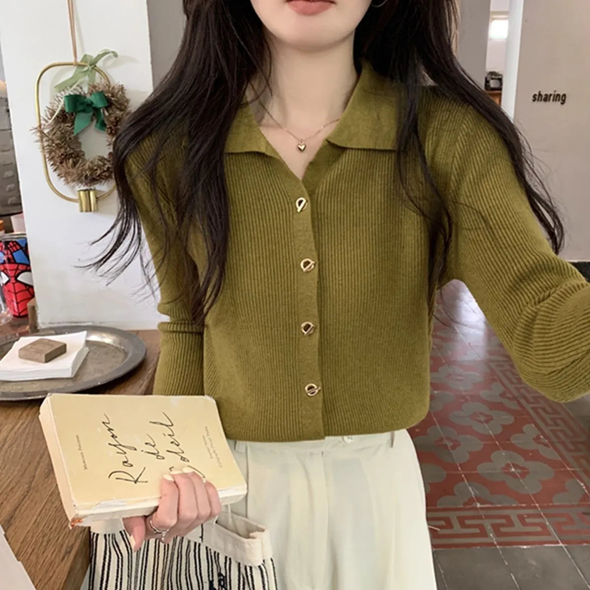 Women's beige knitted cardigan top with long sleeves and loose fit design