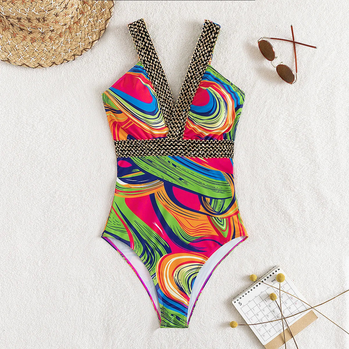 Women's deep V-neck one-piece swimsuit with spaghetti straps in a printed pattern