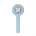 Blue and yellow pet grooming brush with self-cleaning button and angled metal needles
