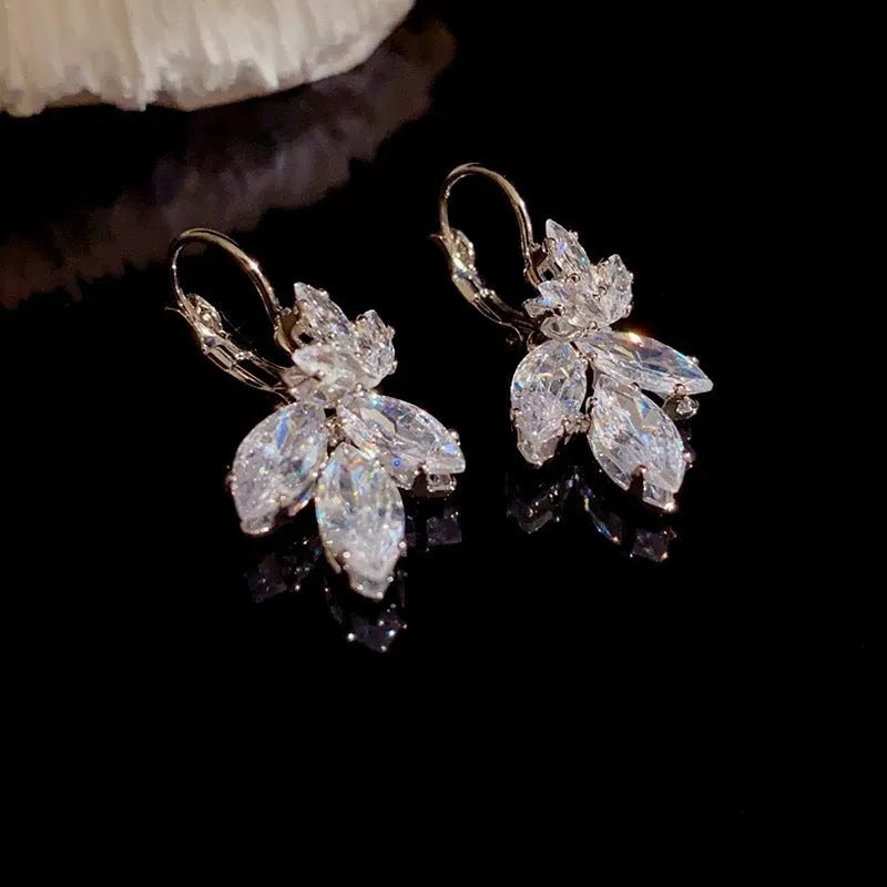Women's delicate leaf earrings with inlaid zircon stones in platinum colour