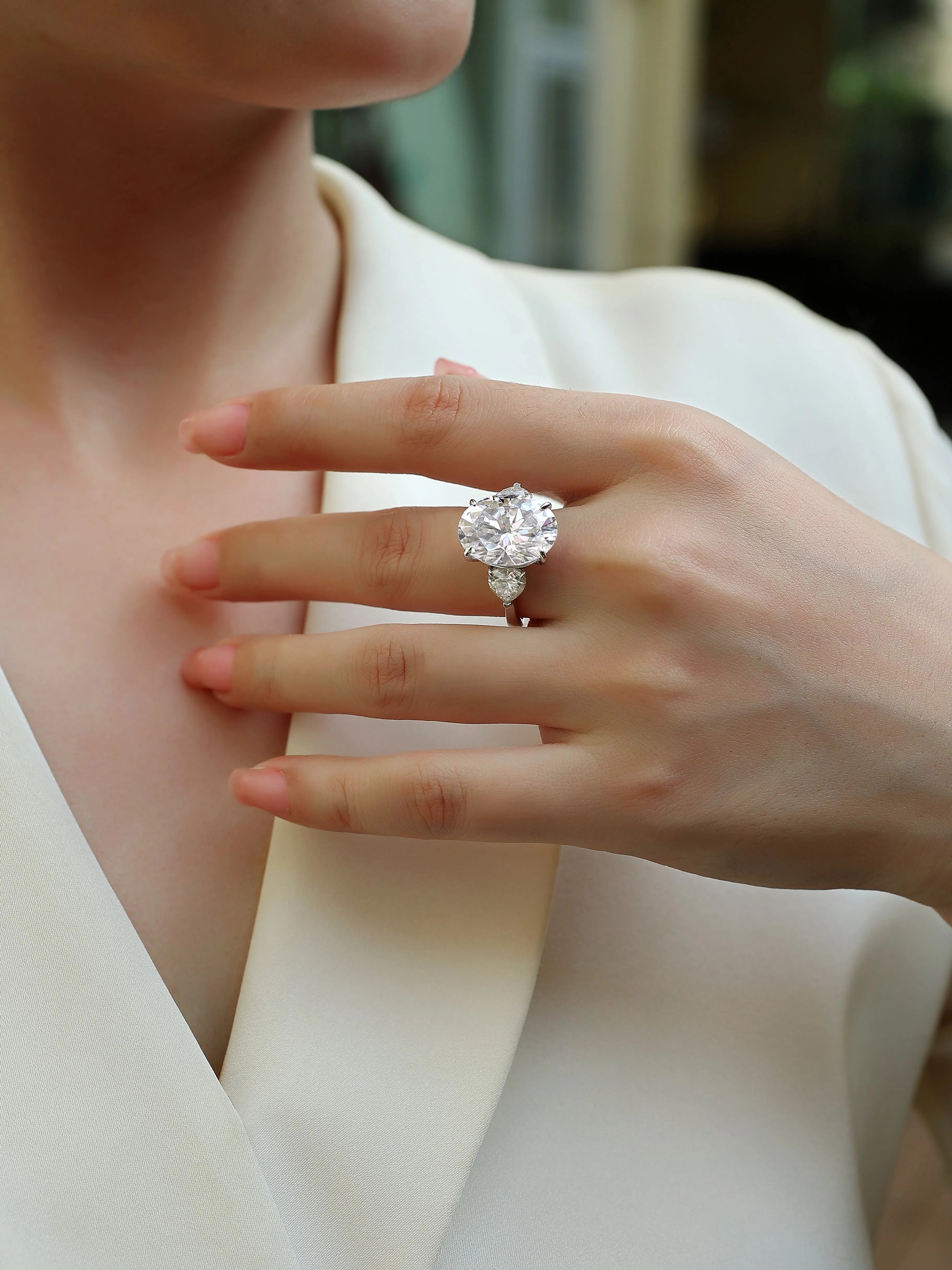 Soul Resonance wedding ring set with egg-shaped moissanite in platinum-plated S925 silver on a white background