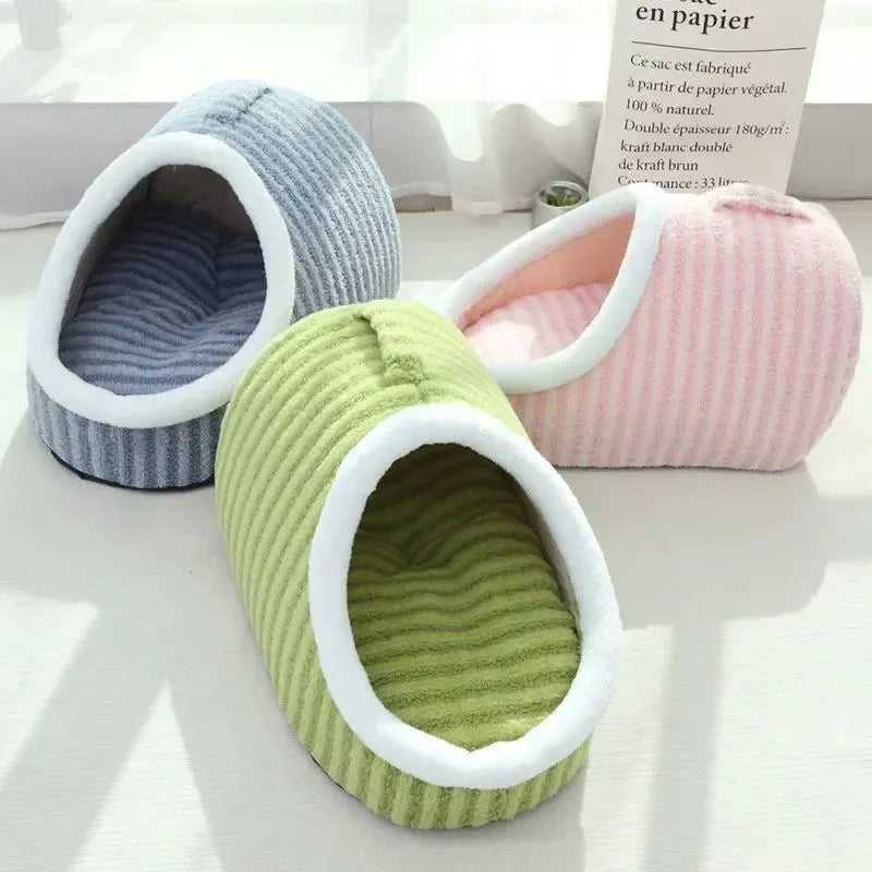 Striped thickened 3D dog bed with removable sponge mattress in blue, shown in a home setting