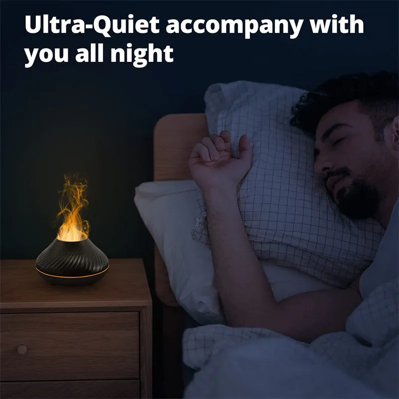 Beige USB aroma diffuser with flame-effect mist and colour-changing night light on a wooden table.