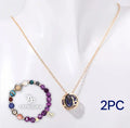 Natural stone beaded necklace and matching bracelet set on a display.