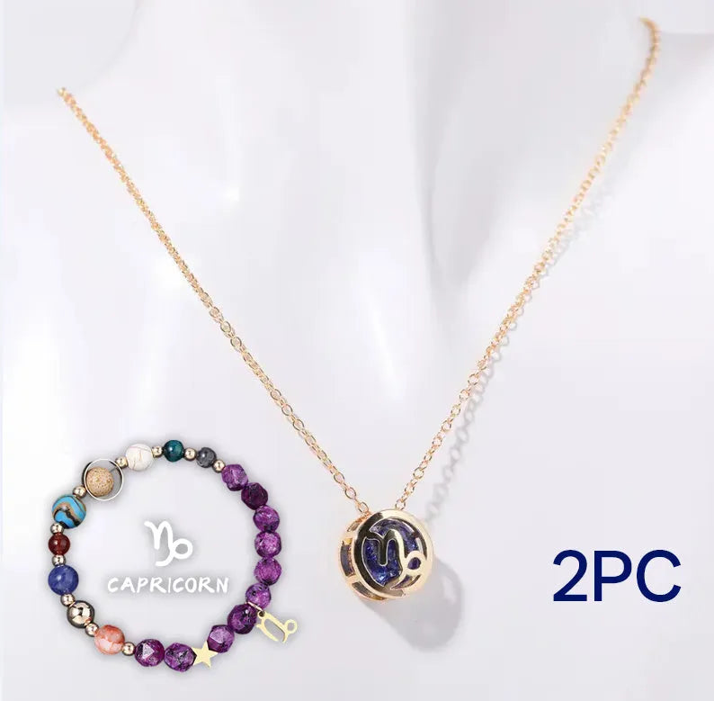 Natural stone beaded necklace and matching bracelet set on a display.