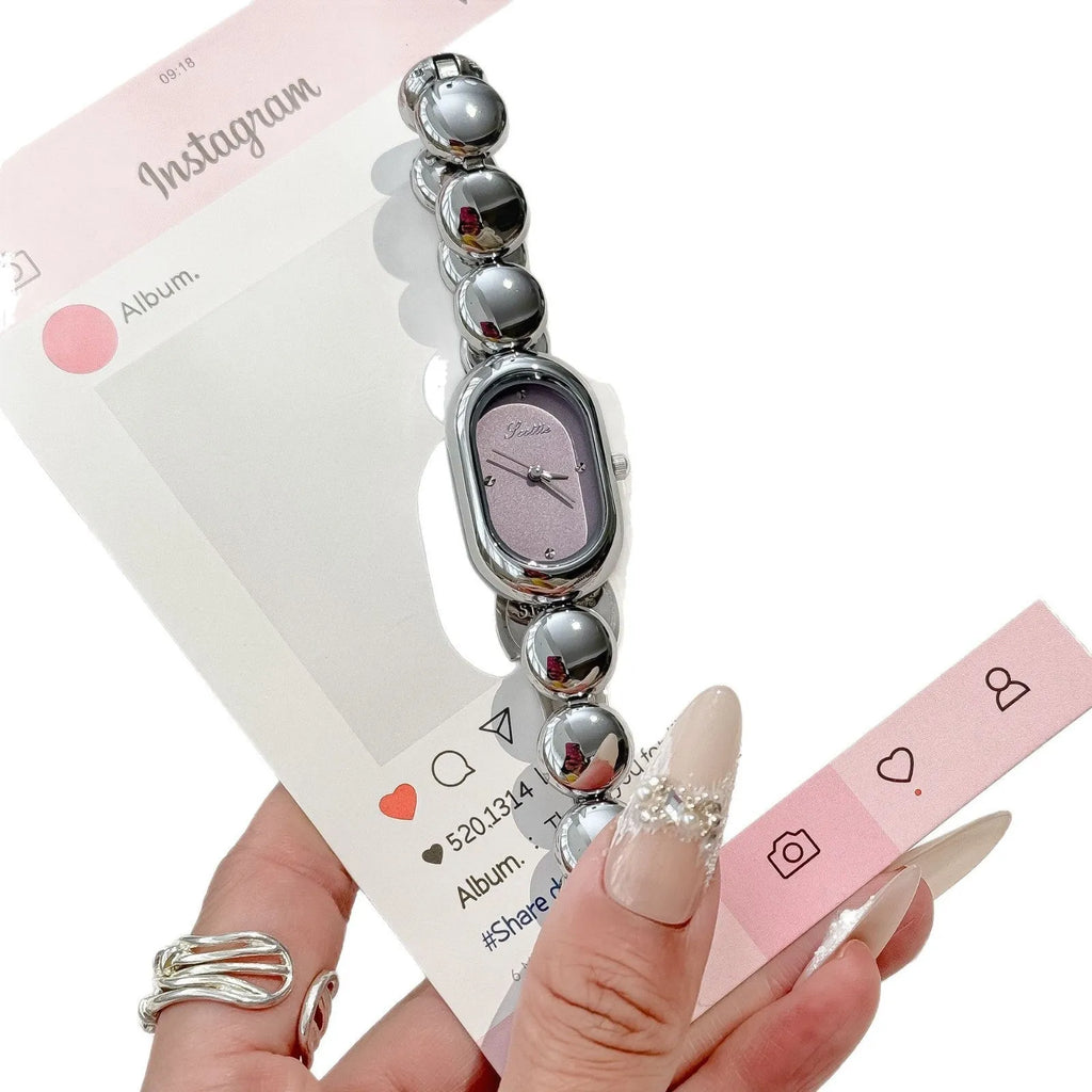 Women's oval dial watch with bracelet strap in multiple colour finishes including gold and platinum options