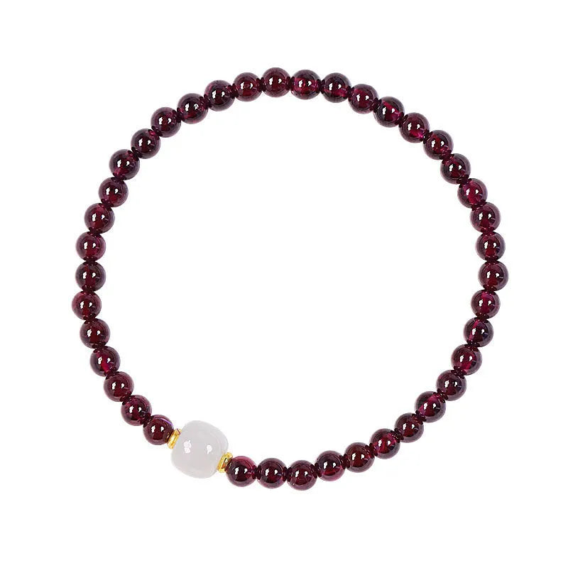 Natural garnet bracelet with U-shaped design showing garnet and dream garnet colour options