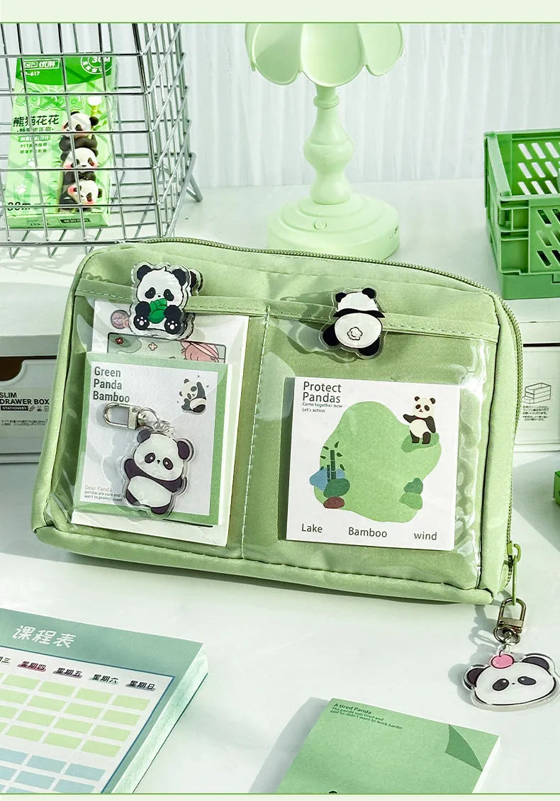 Green canvas pencil case with panda design showing 12-layer compartments open