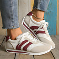 Wine red Cortez retro sneaker with cross strap and breathable mesh surface.