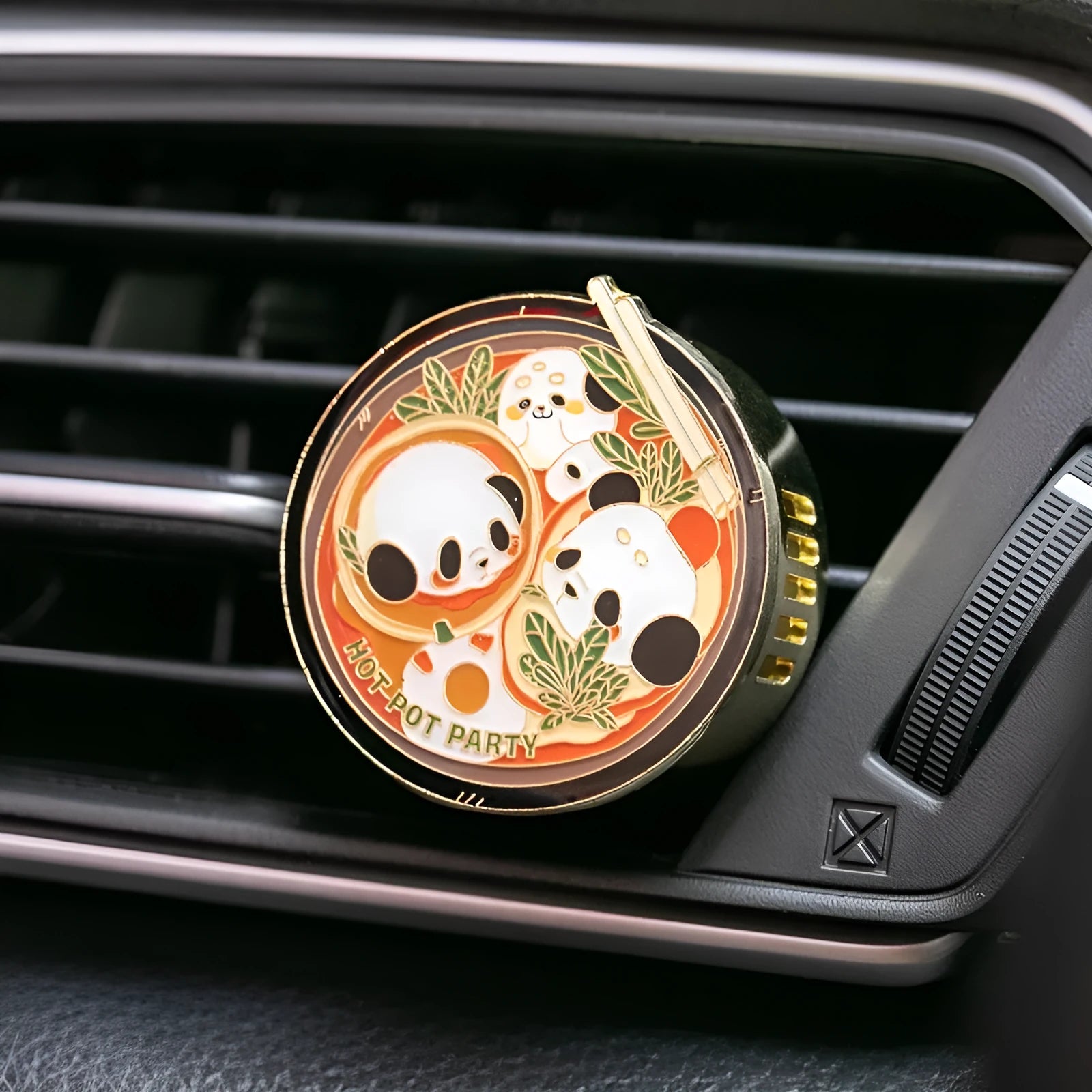 Panda-shaped car air freshener diffuser with changeable fragrance tablets for vehicle odour removal.