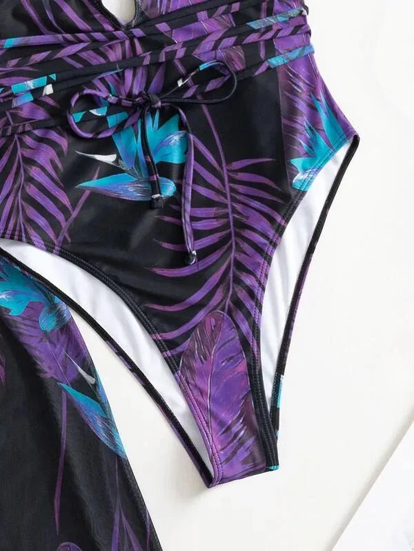 Women's patterned bikini one-piece swimsuit and matching coat set on a mannequin.