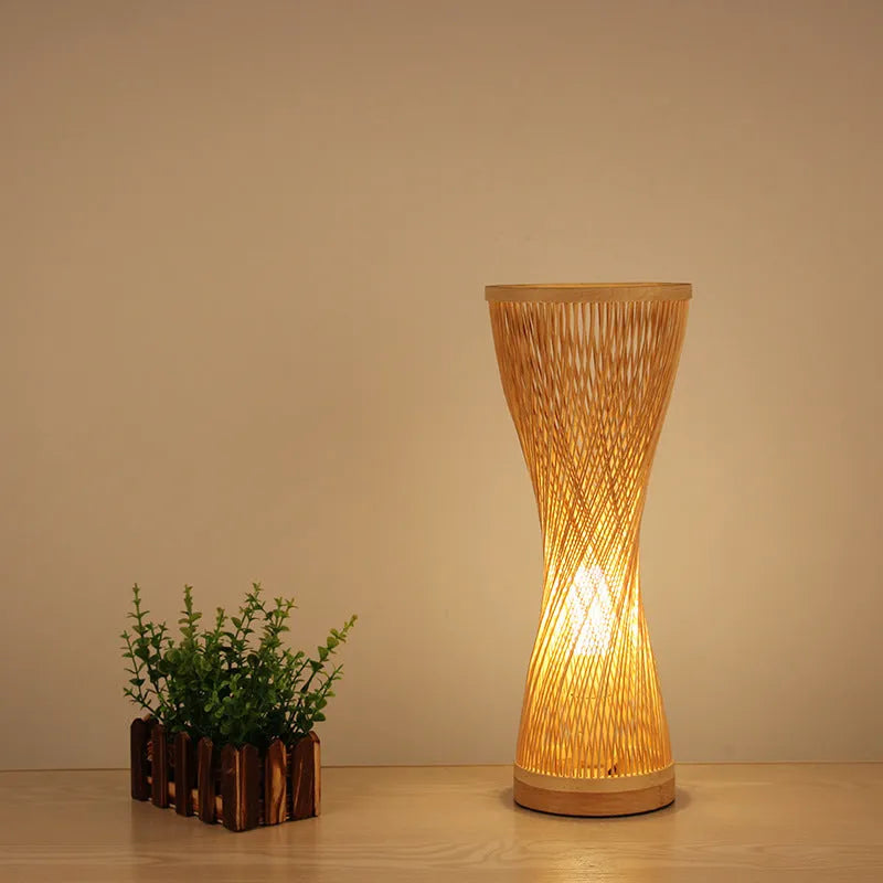 Hand-woven bamboo bedside lamp with natural finish, 40cm height, on wooden bedside table