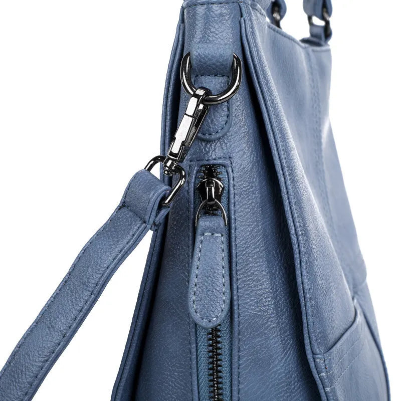 Soft PU retro style crossbody handbag in barrel shape showing pocket sandwich design.