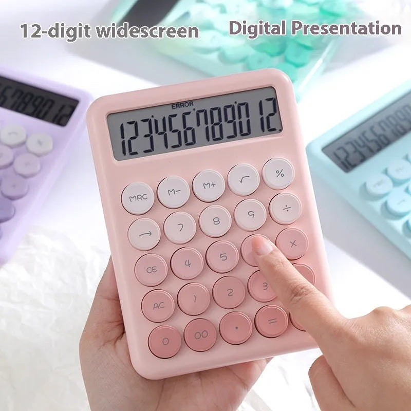 Dopamine gradient colour desk calculator in violet, pink, blue, and green on a white desk.