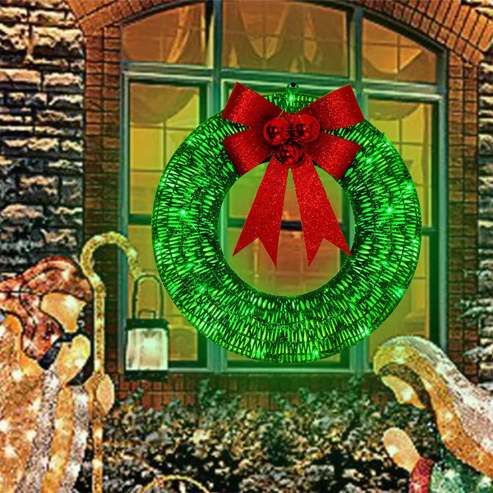 50cm gold green tinsel Christmas garland with LED lights and big bowknot on a wooden door