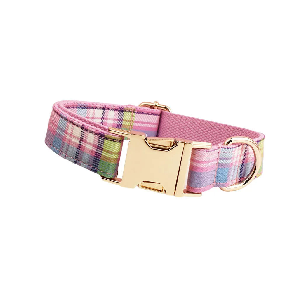 Four-piece cloth dog accessory set showing collar, leash, vest, and bow for coordinated pet styling