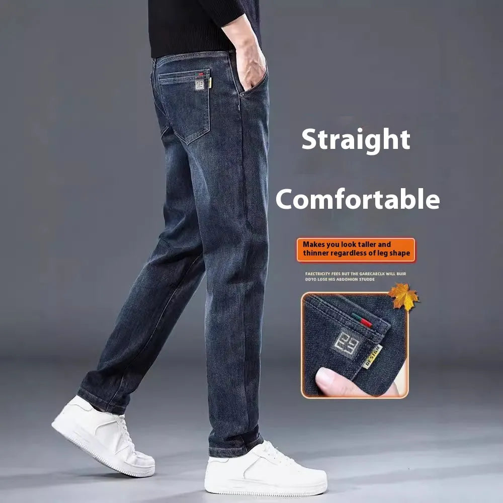 Blue grey men's slim straight casual trousers with a mid waist and zip fly on a neutral background.