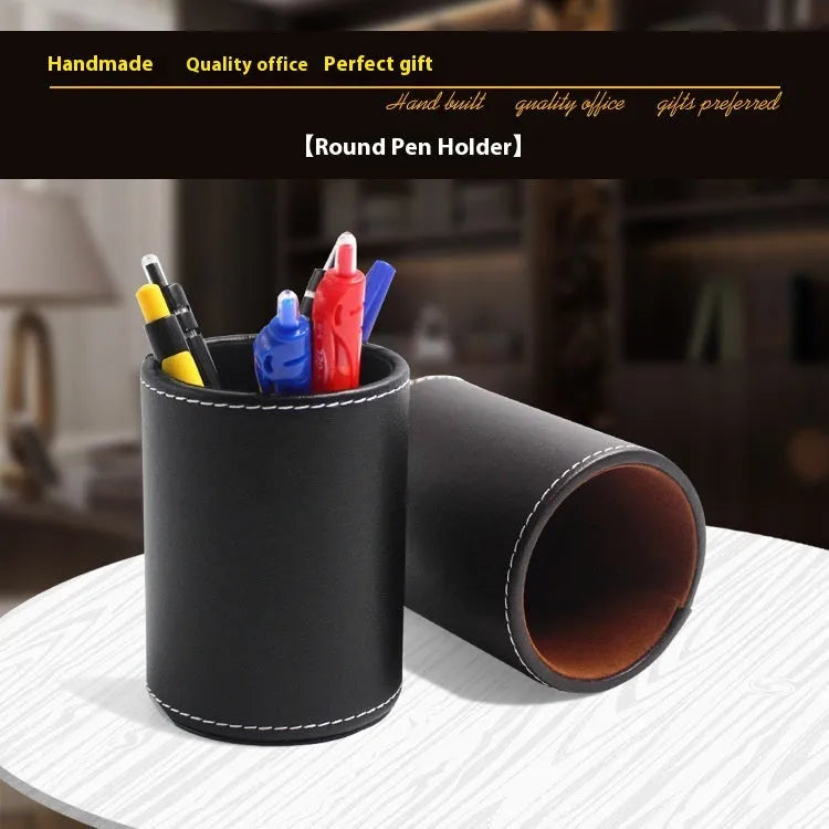 Round black leather pen holder with 8.0cm diameter on desk