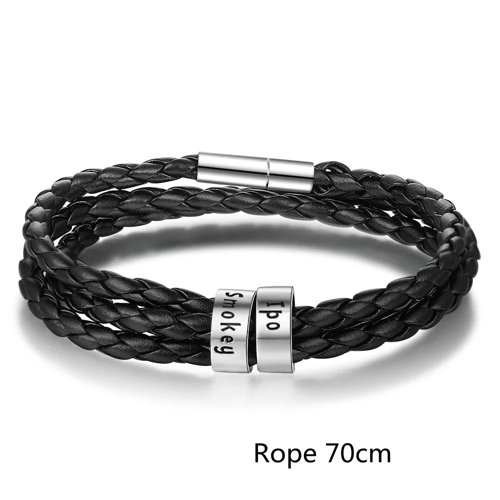 Personalized leather bracelet with engraved name charm for men, featuring a braided design and stainless steel beads