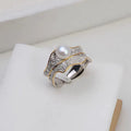 Freshwater pearl ring with irregular leaf design, electroplated metal band, pearl colour, adjustable opening