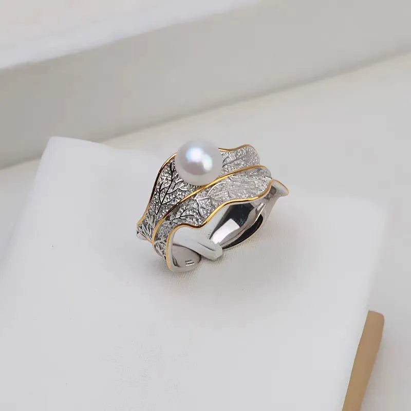 Freshwater pearl ring with irregular leaf design, electroplated metal band, pearl colour, adjustable opening