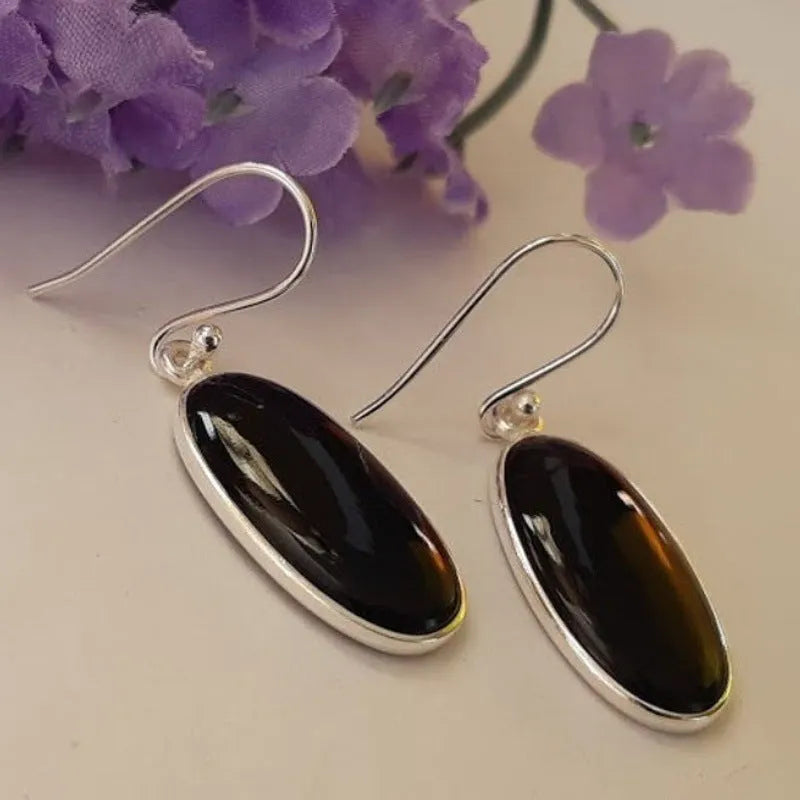Women's black oval agate pendant earrings with 925 silver detail and geometric Chinese design