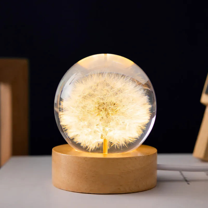 3D dandelion eternal flower night light in resin crystal ball on beech wood stand.