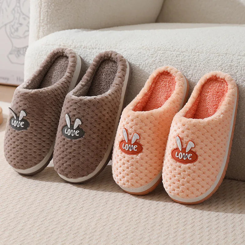 Women's plush rabbit plaid design house slippers with artificial fur and a light brown anti-slip rubber sole.