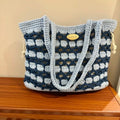 Handwoven wool floral handbag in one of six available summer style patterns.