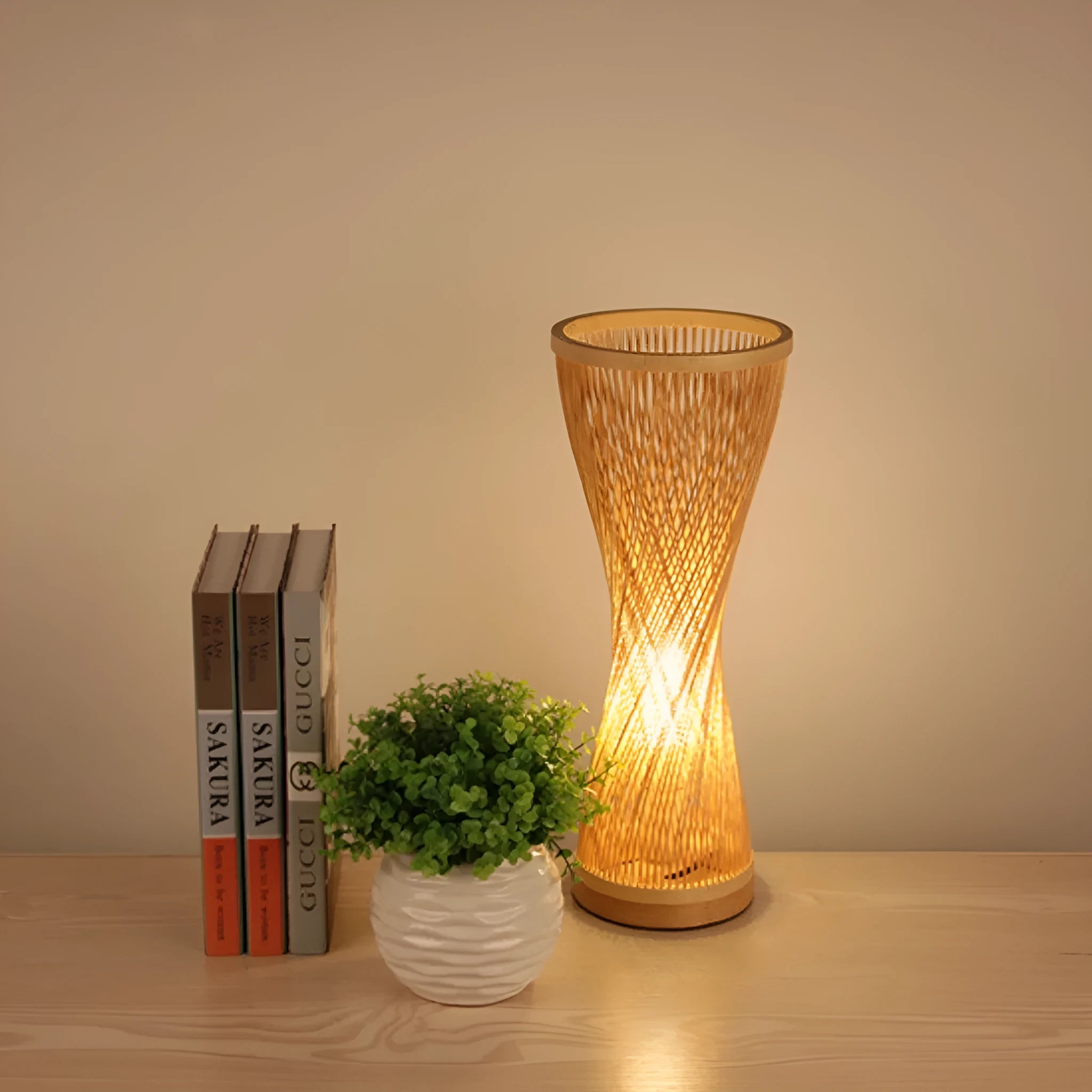 Hand-woven bamboo bedside lamp with natural finish, 40cm height, on wooden bedside table