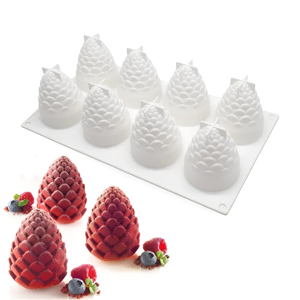 Flexible silicone baking mould with six cavities shaped like pine cones, pineapples, and pears.