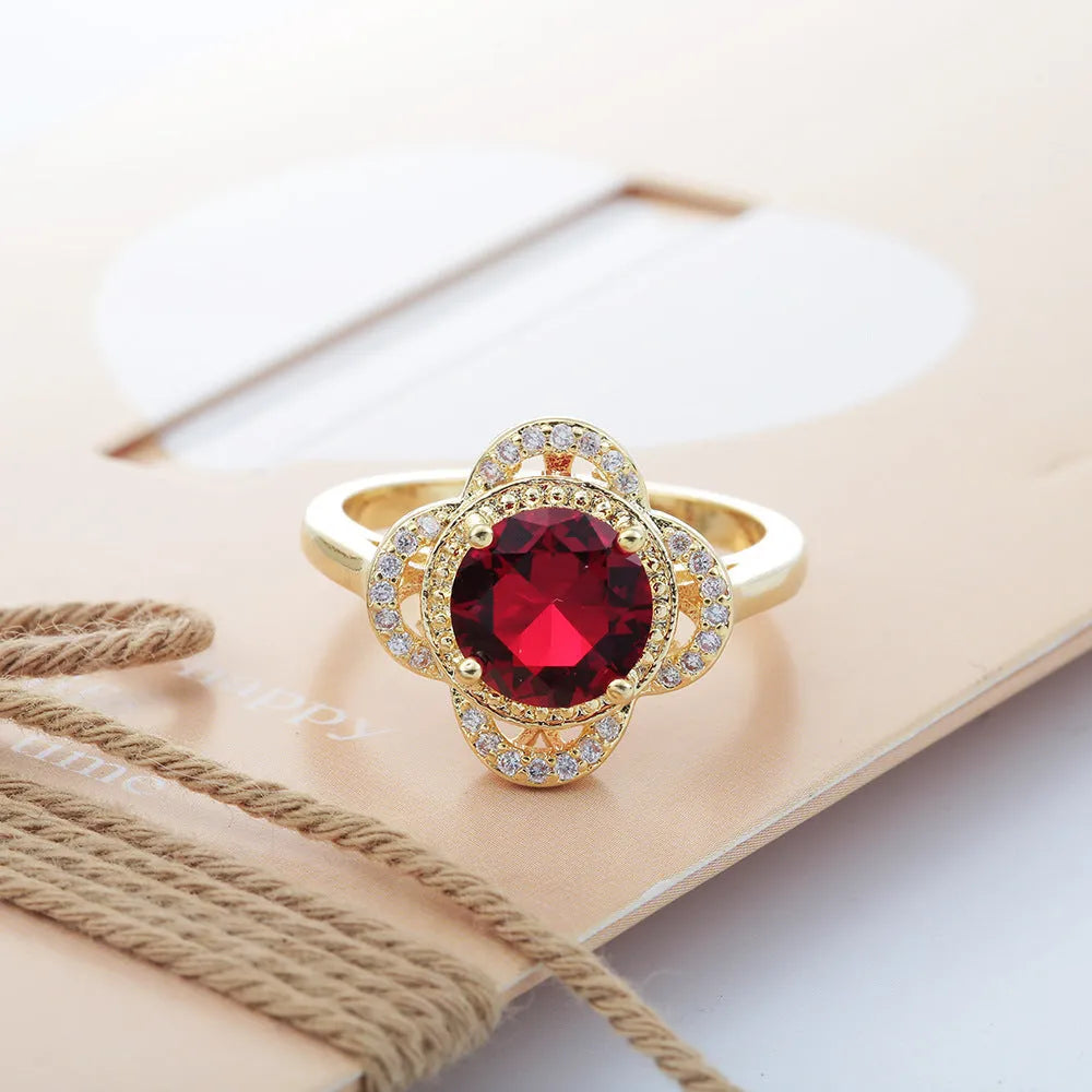 Copper zircon fruit-shaped ring with electroplated finish shown in size options