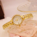 Women's vintage-style quartz watch with diamond-embossed dial and gold metal bracelet
