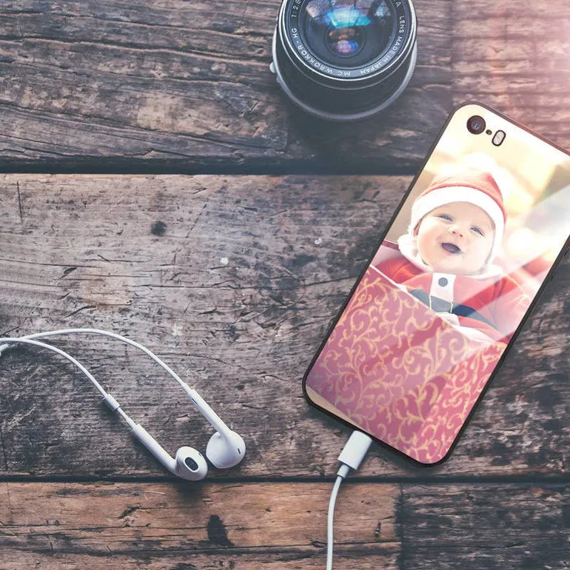 Patterned ultra-thin iPhone case with raised edges protecting the screen and camera lens.