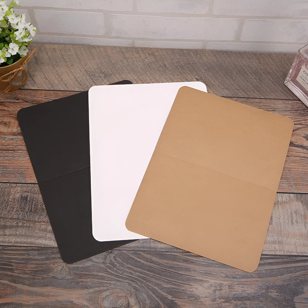 Pack of 100 blank folded kraft paper cards in 10x15 cm size, shown in black, brown, and white colours.